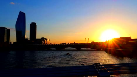 Amazing-golden-hour-view-of-Thames-River-with-small-boats-and-London-skyscrapers