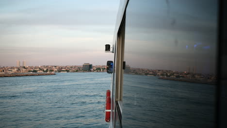 Symmetrical-reflections-on-a-tour-boats-window-at-Istanbul