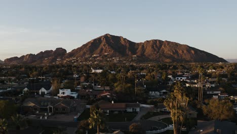 Aerial-view-of-residential-homes-beneath-Camelback-Mountain-in-Arizona