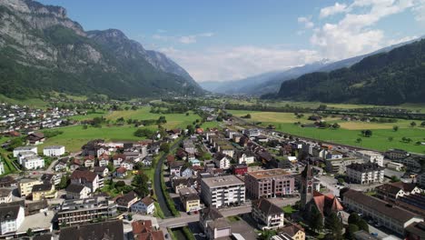 Flight-over-houses-and-beautiful-landscapes-in-Walenstadt-city,-Switzerland,-Europe