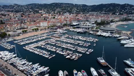 Drone-flying-over-boats-and-yachts-moored-in-marina-on-French-Riviera