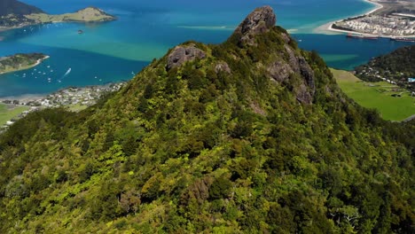 Mount-Manaia-peak-aerial-reveal-of-oceanside