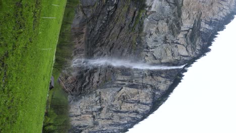 Famous-Waterfall-in-Lauterbrunnen,-Switzerland---Low-Angle-Vertical