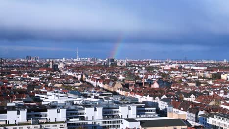 Gold-treasure-at-the-end-of-the-rainbow-in-capital-Germany-city-berlin-grey-cloudy-sky