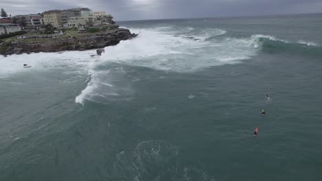 Adventurous-Surfers-Riding-On-Stormy-Waves-At-Bondi-Beach-In-New-South-Wales-Amidst-The-Risk
