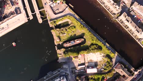 Aerial-look-down-motion-to-shipwreck-in-Dublin-Grand-Canal-Dock