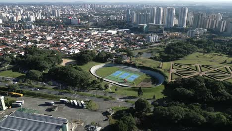 Aerial-Drone-Fly-Above-Botanical-Garden-in-Curitiba-Brazil,-Cityscape-Green-Landscape,-Park-Around-Brazilian-Streets-during-Daylight