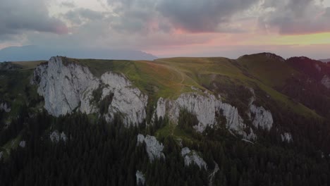 Experience-the-beauty-of-a-summer-mountain-ridge-at-sunset-with-vibrant-colors,-captured-by-a-mesmerizing-drone-footage