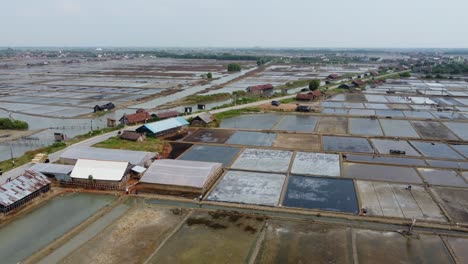 Aerial-view-of-view-of-the-vast-expanse-of-salt-ponds-in-Jepara,-Central-Java,-Indonesia