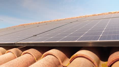 Closeup-slider-shot-of-array-of-solar-panel-setup-on-roof-in-France