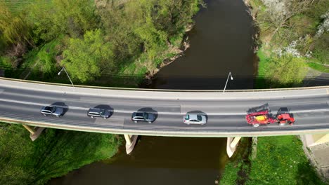 Drone-Shot,-Slow-Camera-Movement-Upwards,-Łęczna,-Poland,-Old-Bridge,-Nature,-River