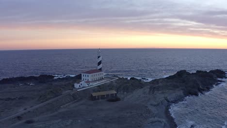 Golden-hour-glow-on-Favaritx-lighthouse-in-Menorca,-Spain