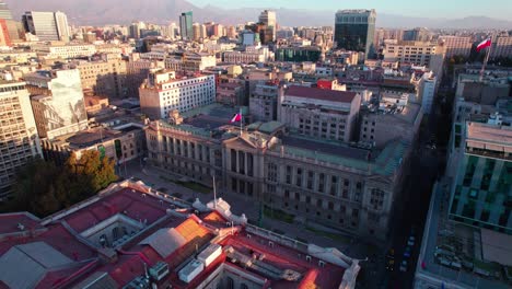 Aerial-view-circling-above-Palace-of-the-Courts-of-Justice-of-Santiago-historical-building-rooftops,-Chile