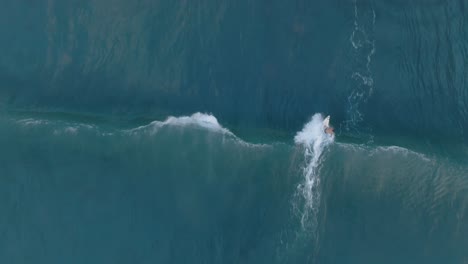 Aerial-Top-Down-Drone-Slow-Motion-view-of-surfers-at-La-Bocana-El-Tunco-El-Salvador