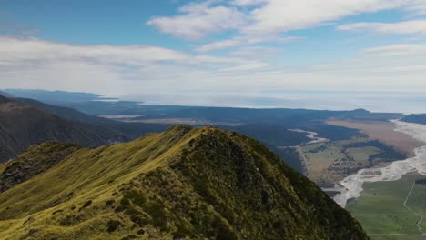 Beautiful-aerial-panoramic-of-lone-person-enjoying-spectacular-view-of-New-Zealand-scenic-landscape