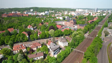 Backward-aerial-over-in-city-Gdańsk-street-near-University-of-technology-in-Gdańsk