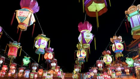 Numerous-colorful-lanterns,-which-symbolize-prosperity-and-good-fortune,-hanging-from-ceiling-wires-during-the-Mid-Autumn-Festival,-also-called-Mooncake-Festival