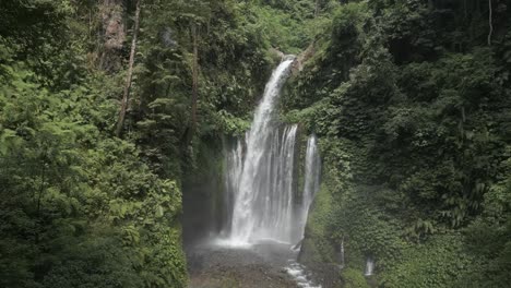 Misty-Tiu-Kelep-waterfall-falls-through-steep-Lombok-jungle-foliage
