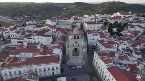 Charming-square-praca-da-republica,-portuguese-countryside-in-background,-aerial