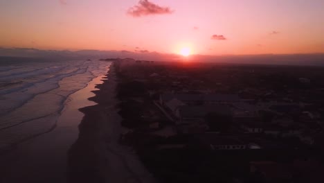 Beautiful-flying-over-waves-in-ocean-beach-in-Brazil,-aerial-shot