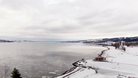 Revealing-vast-freezing-lake-on-cloudy-winter-day