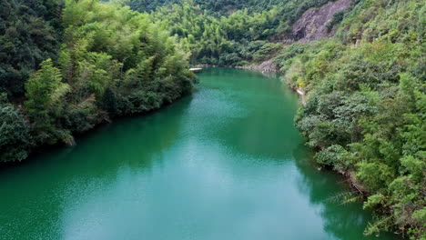 Stunning-Drone-Shot-Flying-Over-Blue-Dam-in-Moganshan,-China