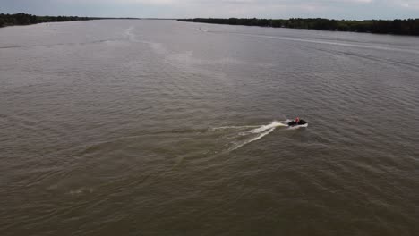 Tracking-Shot-Of-Jet-Ski-Playing-In-Beautiful-Amazon-River,-South-America