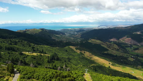 Idyllic-landscape-of-Takaka-valley-and-Tasman-bay,-New-Zealand,-aerial-view