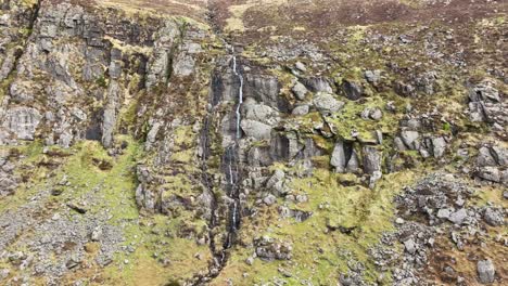 Waterford-Mahon-Valley-Comeragh-Mountains-steep-cliff-and-waterfall-with-scree-slopes-under-the-cliffs-on-a-spring-morning
