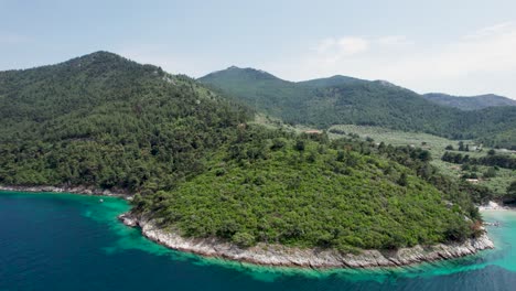 Drone-View-Over-Glifoneri-Beach-With-White-Sand,-Turquoise-Water-And-Lush-Vegetation,-Thassos-Island,-Greece