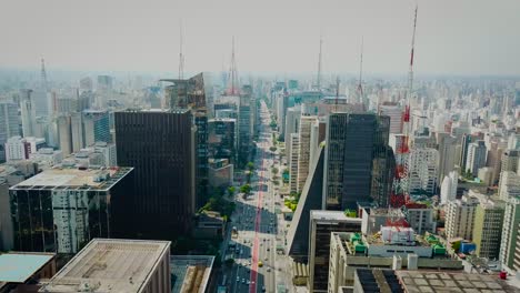 Slow-descending-aerial-shot-of-bussy-Avenida-Paulista-in-São-Paulo