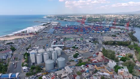 Aerial-flyover-industrial-port-of-Haina-with-cranes-in-City-of-Santo-Domingo