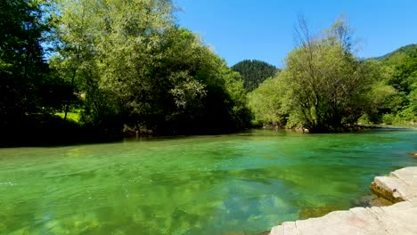 Peaceful-rippling-current-on-a-river-in-Logarska-Dolina,-Slovenia