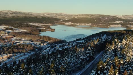 A-bottom-view-aerial-video-of-maridalen-lake-in-Oslo,-Norway-in-winter