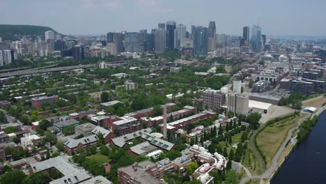 Aerial-view-over-the-Little-Burgundy-area,-tilting-toward-downtown-Montreal,-Canada
