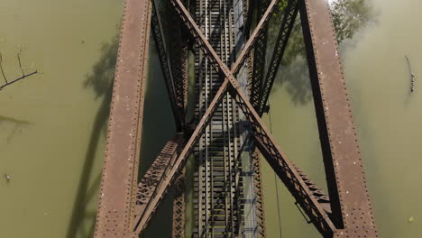 Top-Down-View-Of-Railroad-Bridge-Over-Lee-Creek-In-Van-Buren,-Arkansas,-USA---drone-shot
