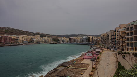 Tiny-beautiful-bay-with-Maltese-township-all-around,-time-lapse-view