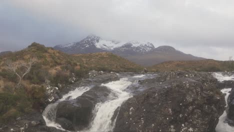 The-view-of-the-Cuillins-and-a-rushing-stream-in-Sligachan-on-an-overcast-day