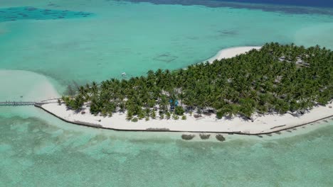 Aerial-panoramic-pan-across-onok-island-reveals-pier-and-sandbar-with-banca