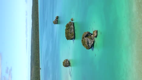 Vertical-aerial-parallax-of-famous-floating-rocks,-Upi-Bay,-Isle-of-Pines