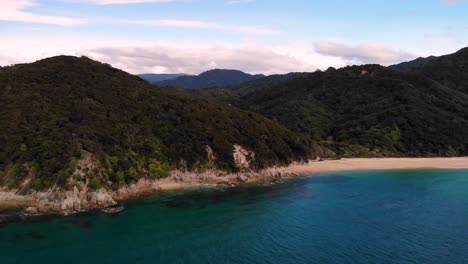 Anapai-Bay-beach-reveal-aerial-shot-of-seaside-landscape-at-Abel-Tasman-National-park,-New-Zealand