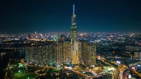 Drone-view-timelapse-hyperlapse-of-Landmark-81-tower-at-night---Ho-Chi-Minh-city,-south-Vietnam