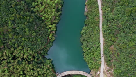 Stunning-Top-Down-Drone-Shot-of-Beautiful-Dam-Lake-in-Moganshan,-China