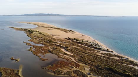 Breathtaking-aerial-drone-view-of-a-strip-of-beach-sand-land-in-Sardinia