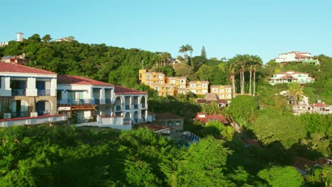 Aerial-View-Above-Resorts,-Holiday-Houses-on-the-Green-Hills-of-Buzios-Brazil-Rio-de-Janeiro,-Beach-Touristic-Destination