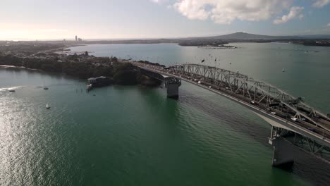 Aerial-view-of-Auckland-Harbour-Bridge-and-North-Auckland,-Rangitoto-Volcano-in-Auckland-gulf