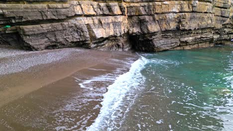 Sea-Waves-Splashing-Shore-And-Cliffs-Of-Amalfi-Coast-In-Italy---drone-shot
