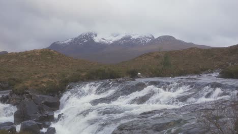 A-view-of-the-Cuillins-and-a-rushing-stream-in-Sligachan,-Isle-of-Skye