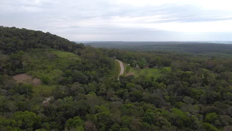 Drone-shot-Argentina-Santa-Ana-Road-in-forest-with-midday-afternoon-with-blue-sky-cloudy-landscape-around-Santa-Ana