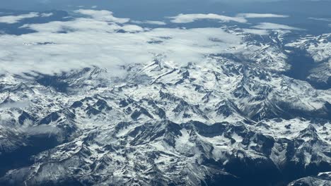 A-pilot’s-ponit-of-view-of-the-snowed-Pyrenees-mountains-between-France-and-Spain,-flying-at-12000m-high